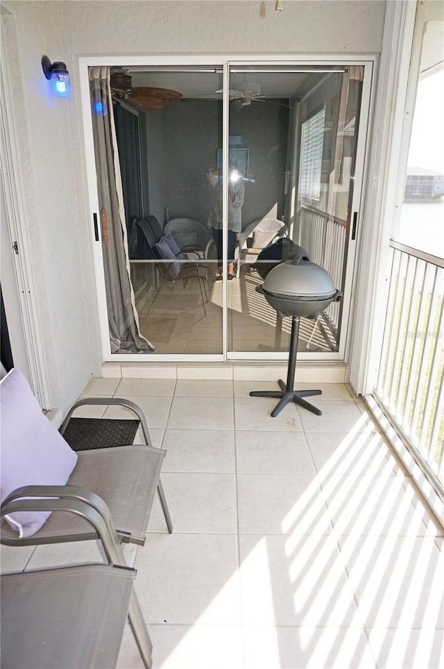 sunroom / solarium with a balcony