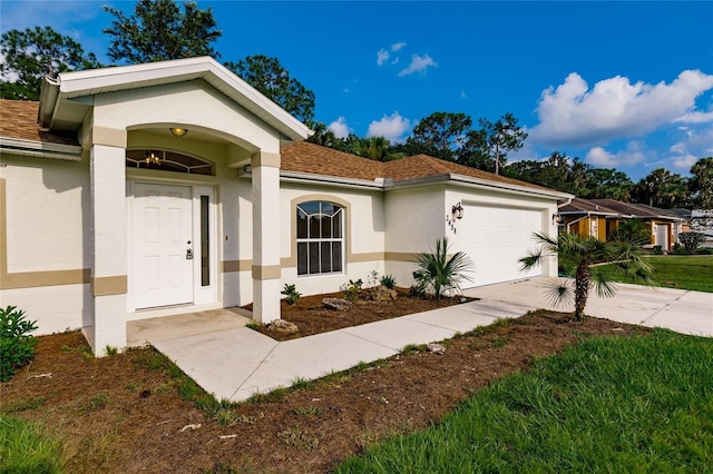 view of front of home with a garage