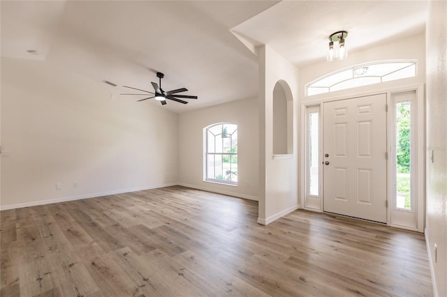 entryway with a wealth of natural light and light hardwood / wood-style flooring