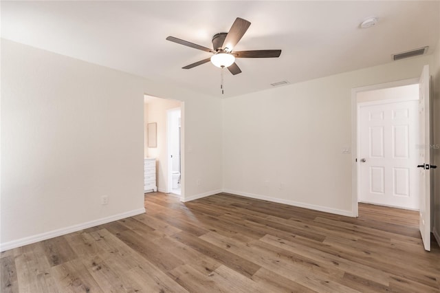 unfurnished room featuring ceiling fan and hardwood / wood-style floors