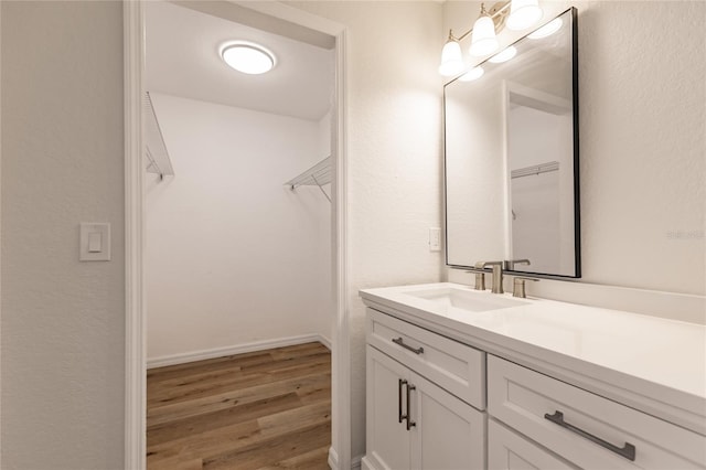 bathroom featuring wood-type flooring and vanity