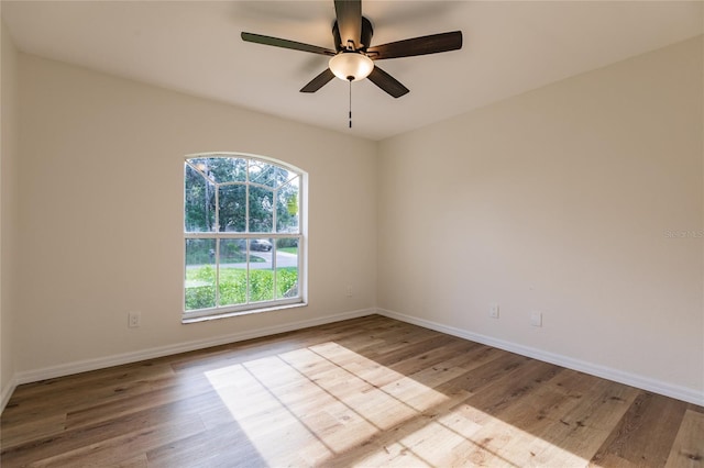 spare room with light hardwood / wood-style floors and ceiling fan