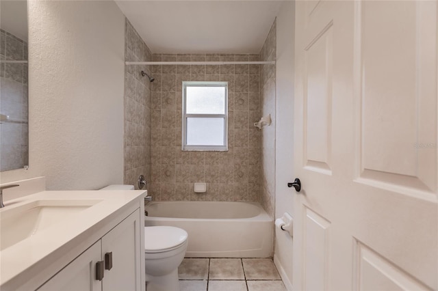 full bathroom with tile patterned flooring, vanity, toilet, and tiled shower / bath combo