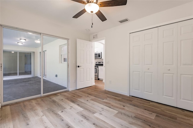 unfurnished bedroom featuring ceiling fan and light hardwood / wood-style flooring