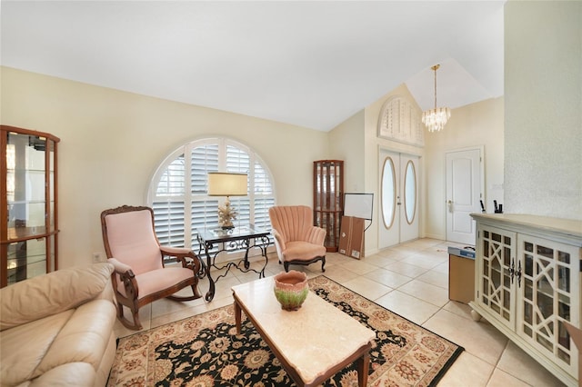 living room with vaulted ceiling, light tile patterned floors, and a chandelier