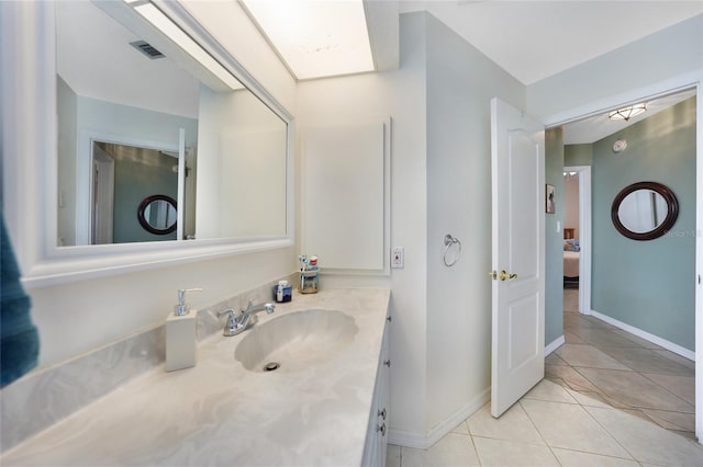 bathroom with tile patterned flooring and vanity