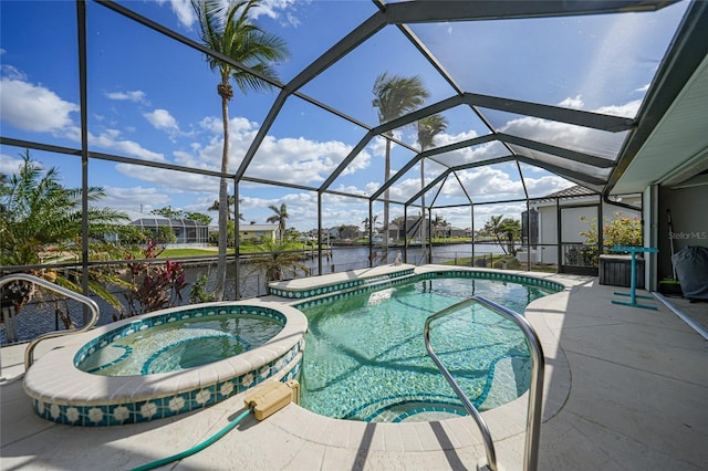 view of swimming pool featuring glass enclosure, an in ground hot tub, a water view, and a patio