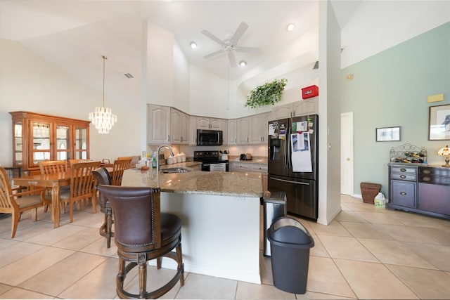 kitchen featuring hanging light fixtures, black electric range, high vaulted ceiling, kitchen peninsula, and fridge