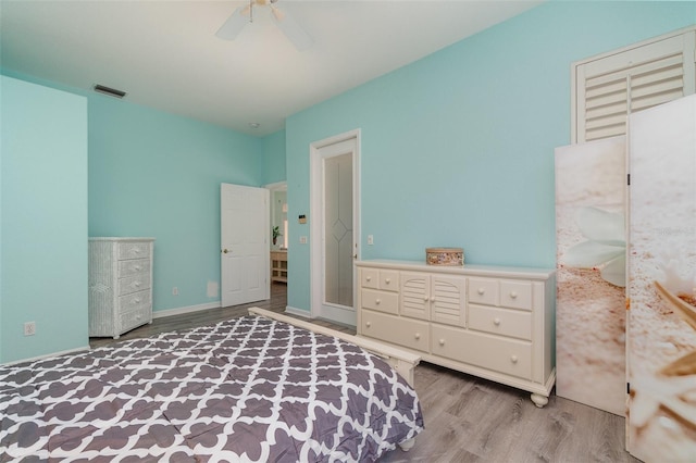 bedroom featuring ceiling fan and light hardwood / wood-style flooring