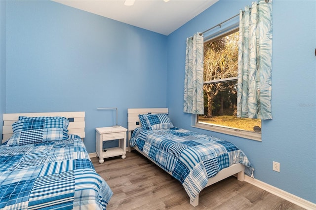 bedroom featuring wood-type flooring and ceiling fan