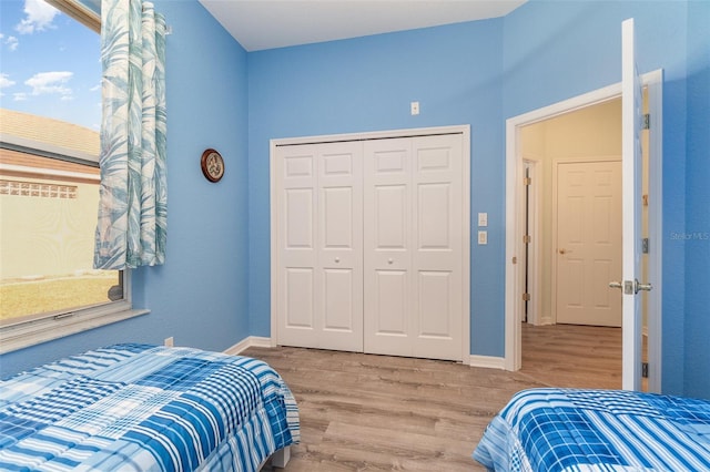 bedroom with a closet and wood-type flooring