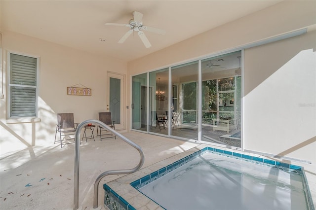 view of swimming pool featuring ceiling fan, a patio, and an indoor in ground hot tub