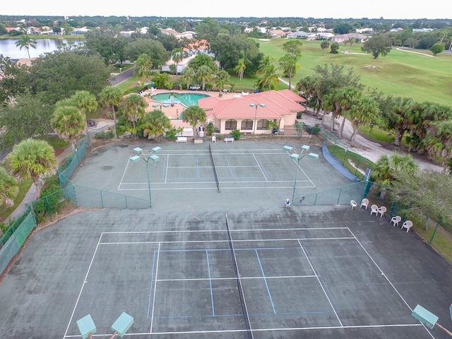 birds eye view of property with a water view