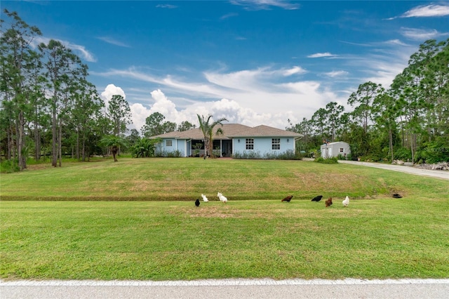 ranch-style house with a front yard