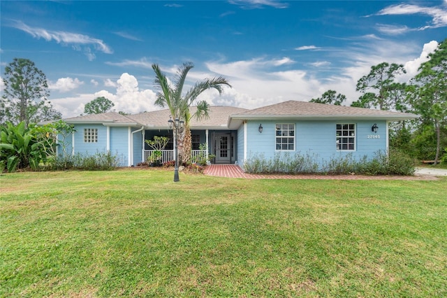 ranch-style home featuring a front yard