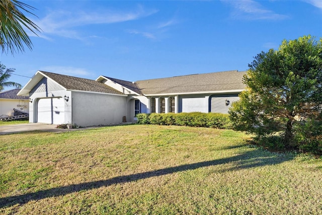 ranch-style house featuring a front lawn and a garage