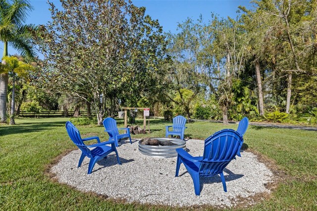 view of yard with a fire pit