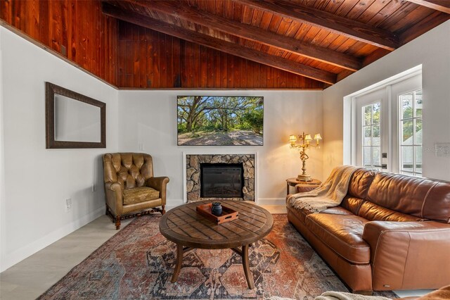 living room featuring french doors, lofted ceiling with beams, hardwood / wood-style flooring, and wood ceiling