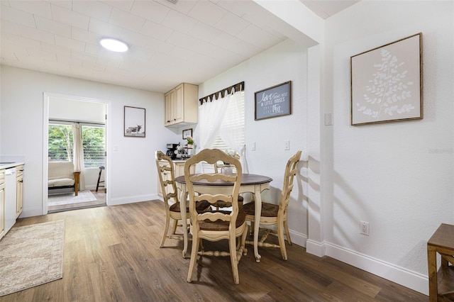 dining space featuring hardwood / wood-style floors