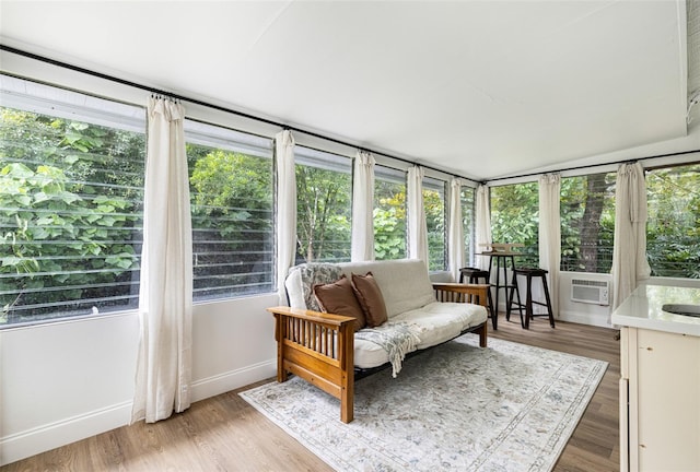 sunroom featuring plenty of natural light and vaulted ceiling