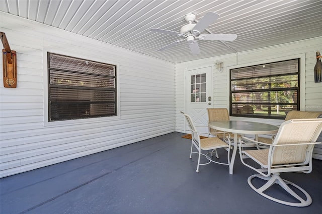 exterior space with ceiling fan