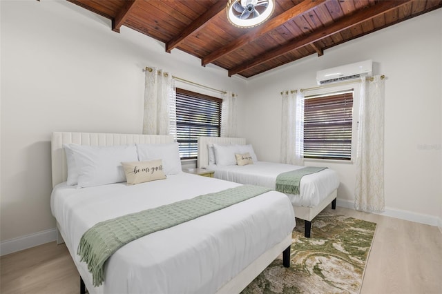 bedroom featuring an AC wall unit, lofted ceiling with beams, light hardwood / wood-style flooring, and wood ceiling