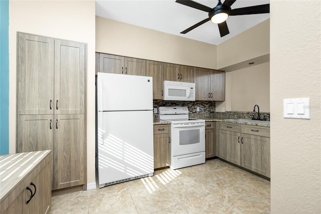 kitchen with backsplash, ceiling fan, sink, and white appliances