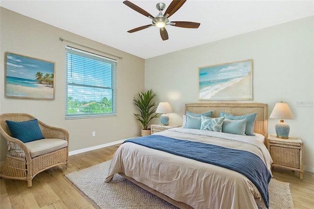 bedroom featuring light wood-type flooring and ceiling fan