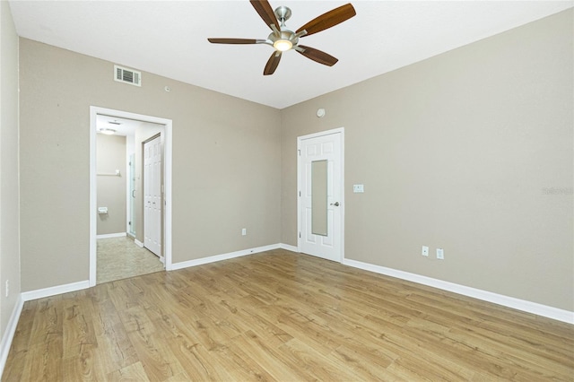 spare room featuring ceiling fan and light wood-type flooring