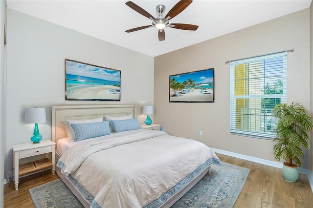 bedroom featuring light hardwood / wood-style flooring and ceiling fan