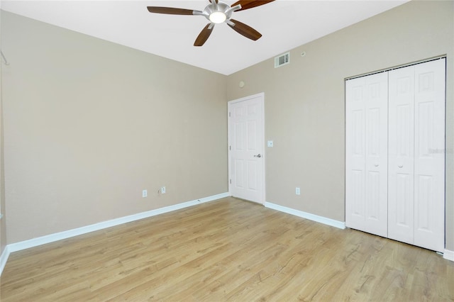 unfurnished bedroom with a closet, ceiling fan, and light hardwood / wood-style flooring