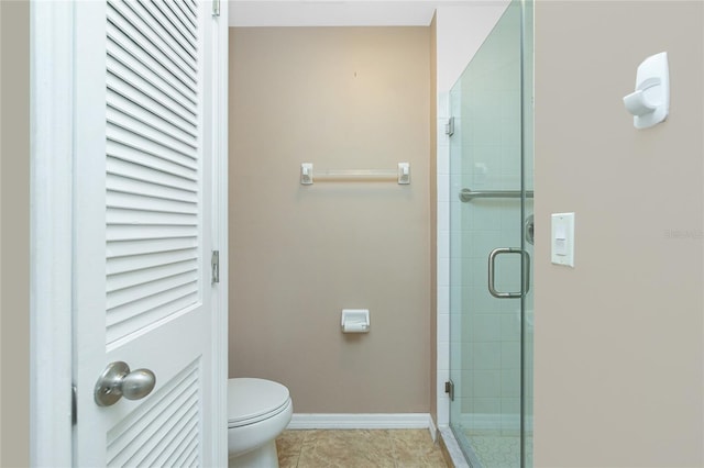 bathroom with tile patterned flooring, an enclosed shower, and toilet