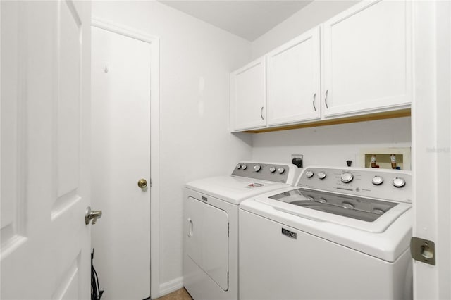 laundry room with cabinets and independent washer and dryer