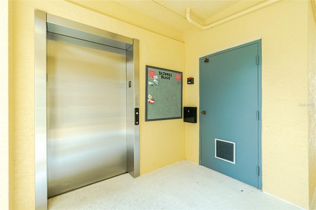 doorway to property featuring elevator