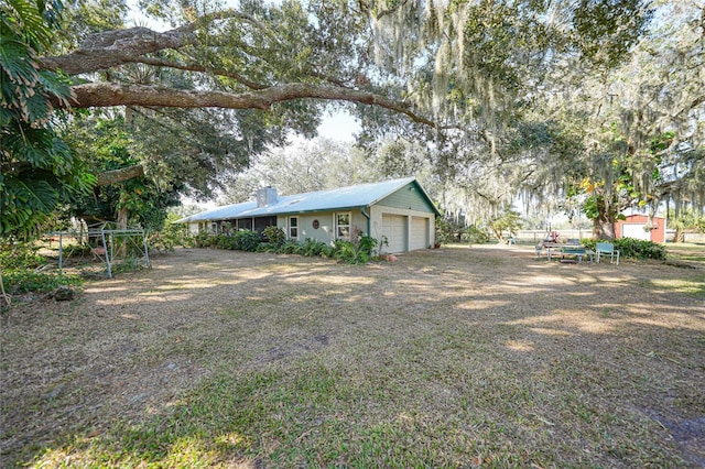 view of yard featuring a garage