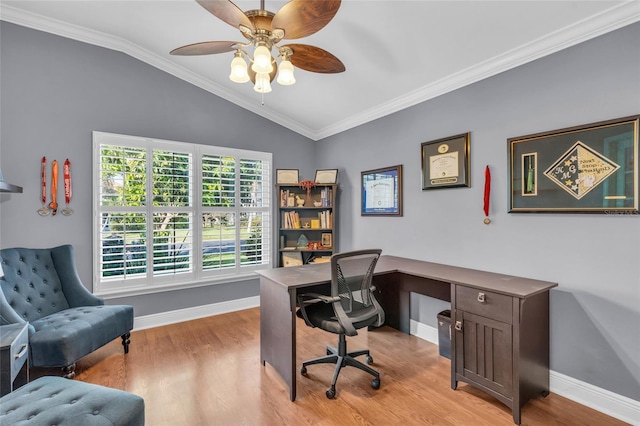 office space featuring light hardwood / wood-style floors, vaulted ceiling, and ornamental molding