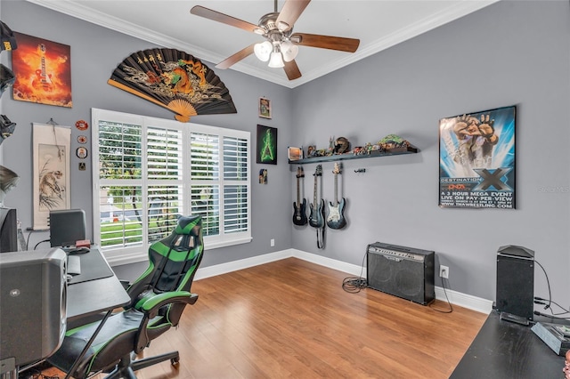 home office with hardwood / wood-style flooring, ceiling fan, and crown molding