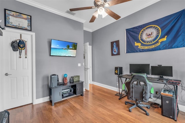 office area with ceiling fan, wood-type flooring, and crown molding