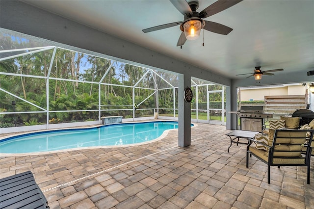 view of swimming pool with ceiling fan, a lanai, grilling area, area for grilling, and a patio