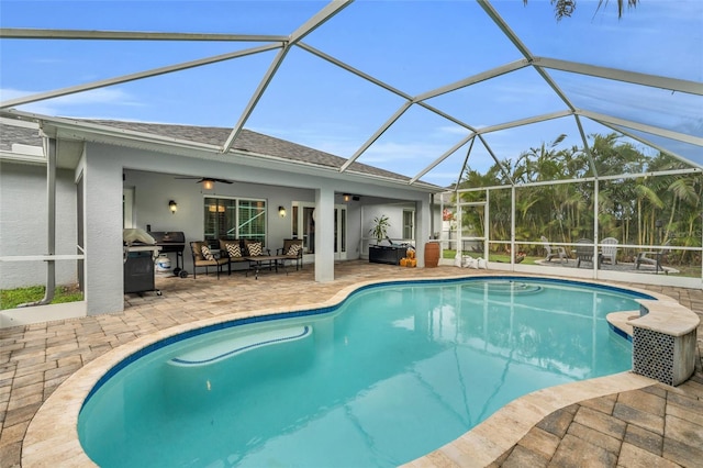 view of swimming pool with area for grilling, an outdoor living space, ceiling fan, glass enclosure, and a patio