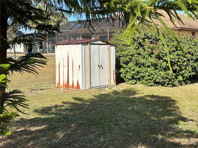 view of outbuilding with a yard