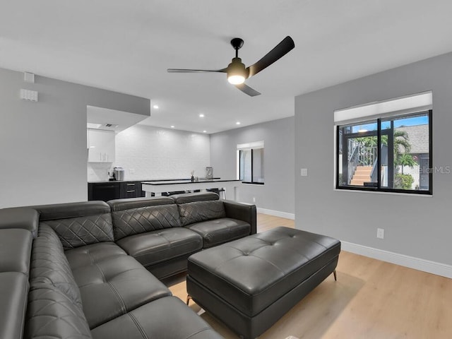 cinema featuring ceiling fan, baseboards, light wood-style flooring, and recessed lighting