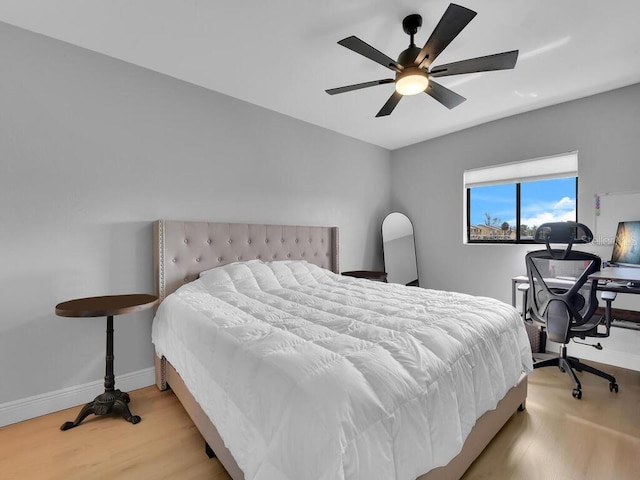 bedroom featuring light hardwood / wood-style floors and ceiling fan