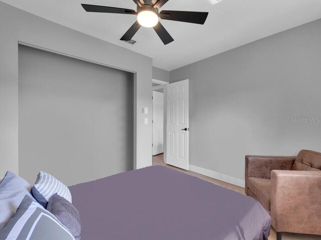 bedroom featuring ceiling fan and wood-type flooring