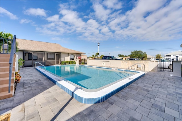 view of swimming pool with a patio