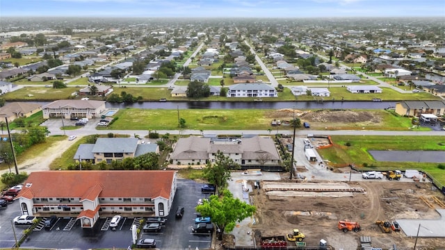 birds eye view of property with a residential view and a water view