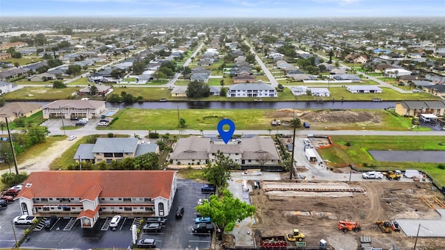 bird's eye view with a residential view and a water view