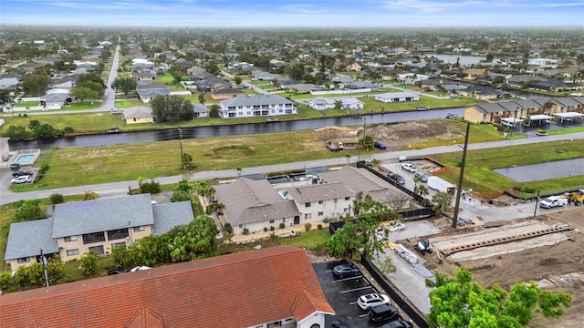 aerial view with a residential view and a water view