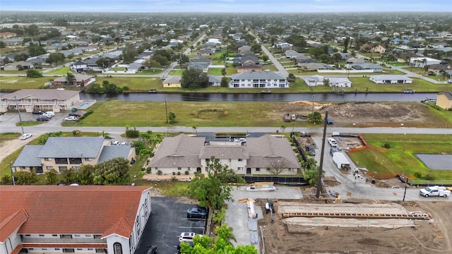 bird's eye view featuring a residential view and a water view