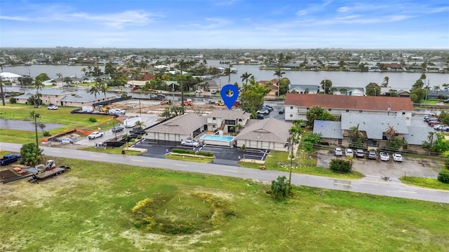 aerial view featuring a residential view and a water view